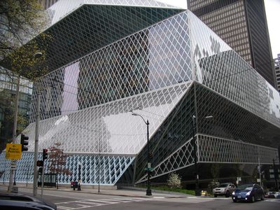 Street-level view of Seattle Central Library’s angular glass-and-steel exterior.